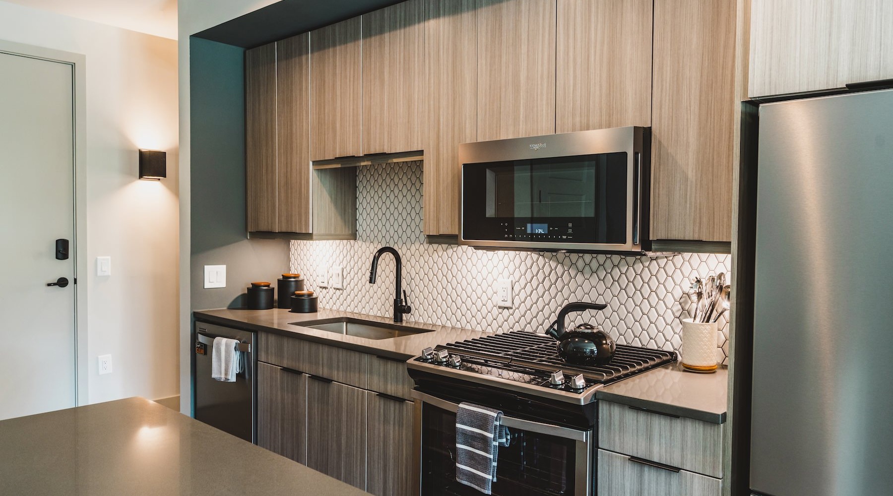 Spacious kitchens with thoughtful details a kitchen with wooden cabinets