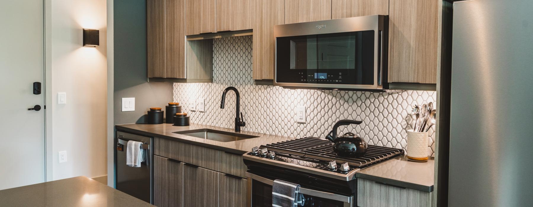 a kitchen with a stove and microwave